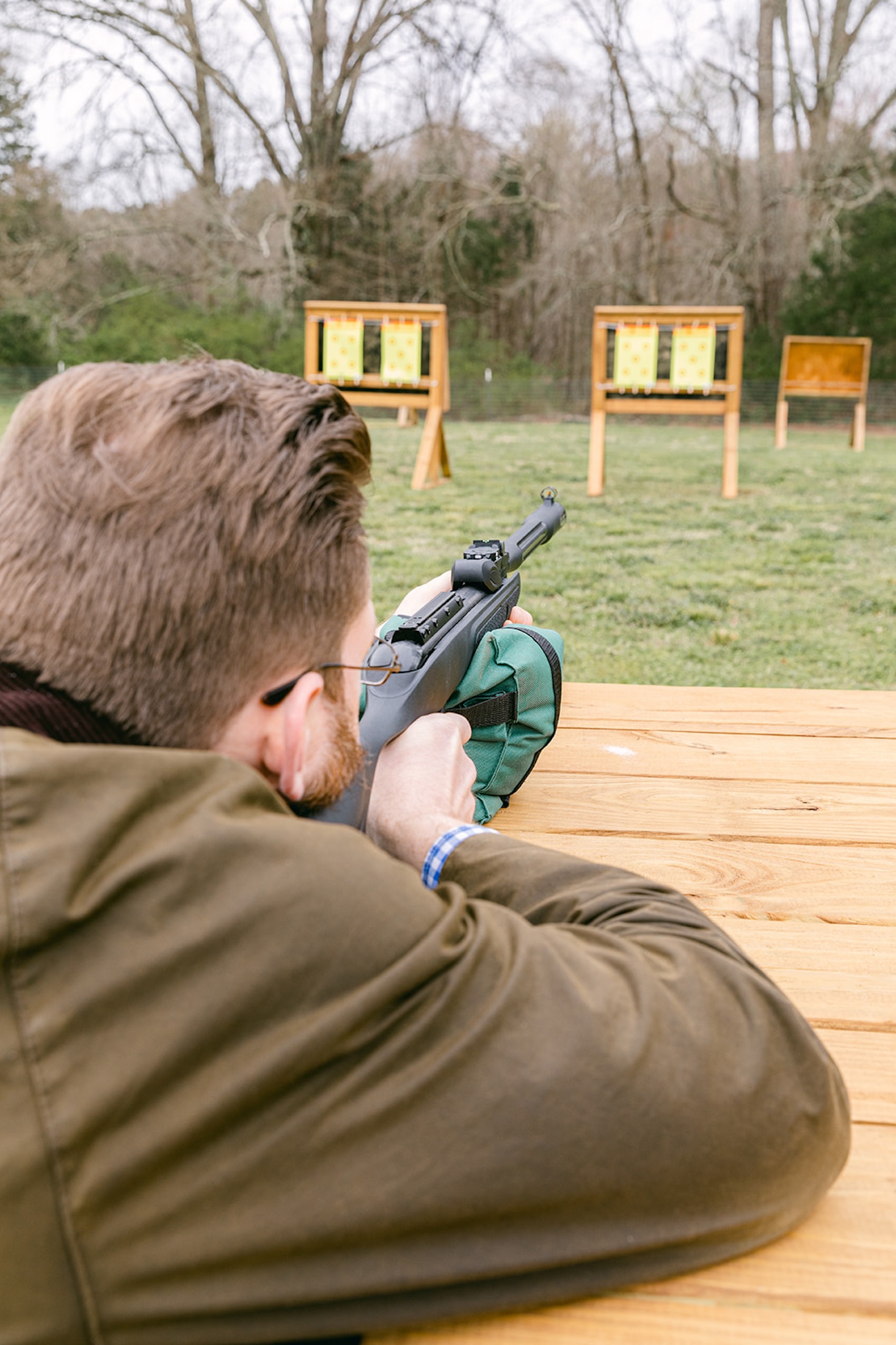 A man shoots an air rifle at targets at Barnsley Resort.