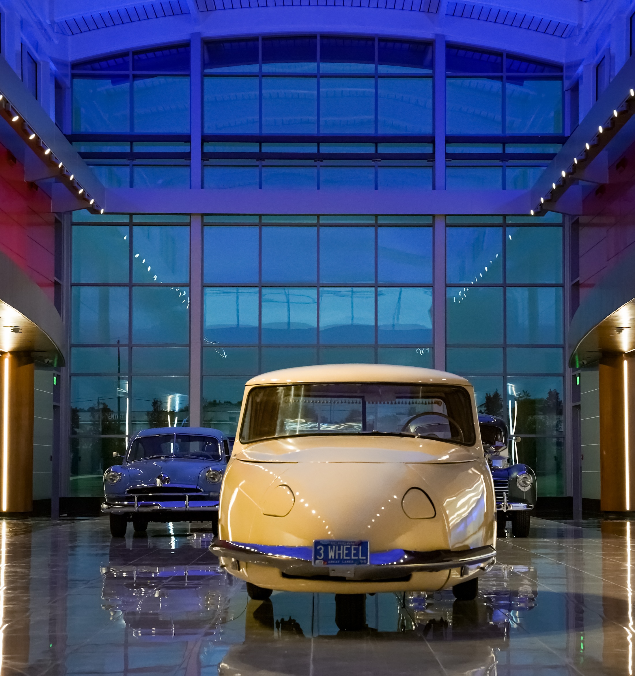 A vintage car in a museum.