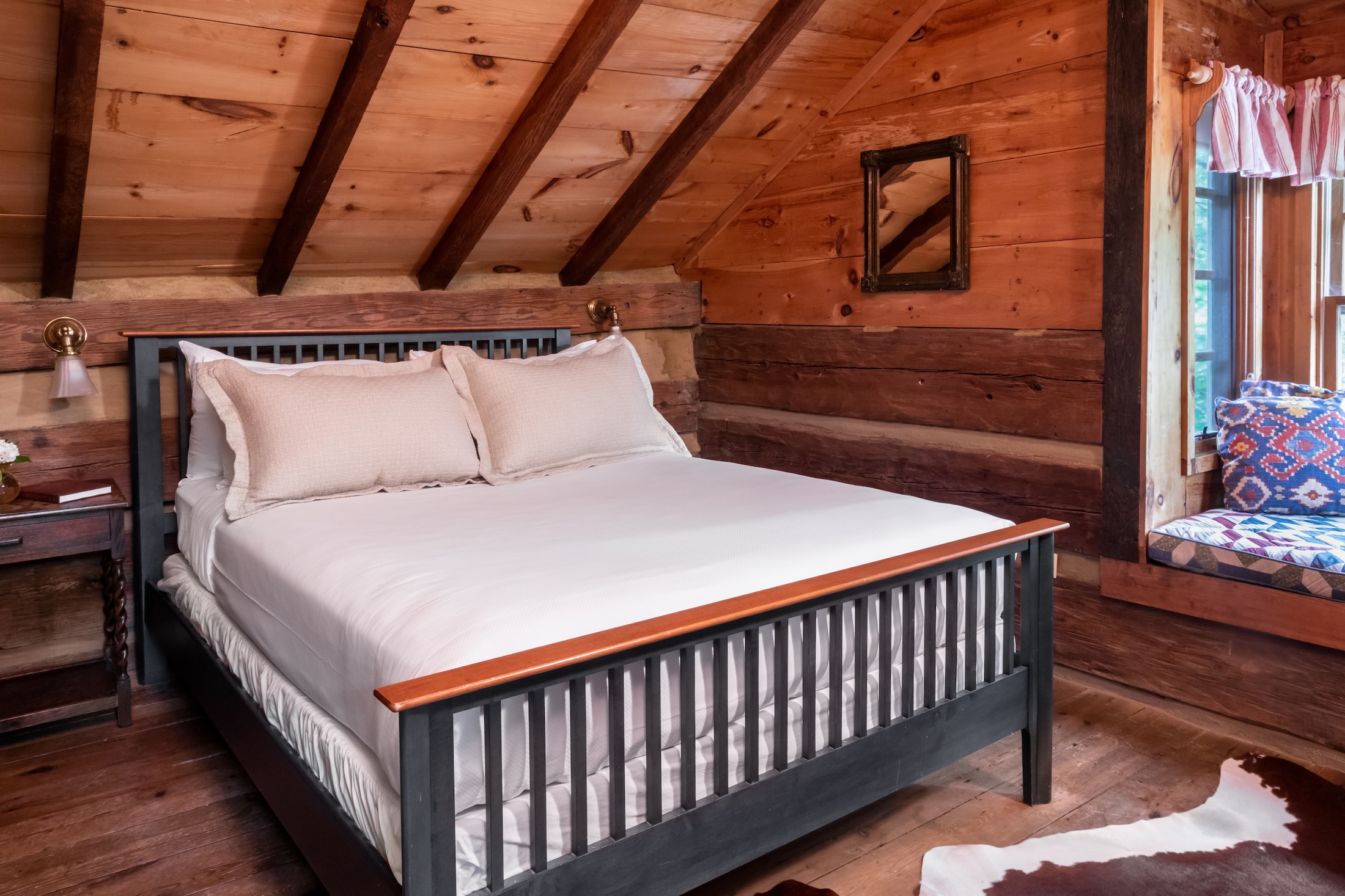 A queen bedroom in the Fugger Cabin at Barnsley Resort.