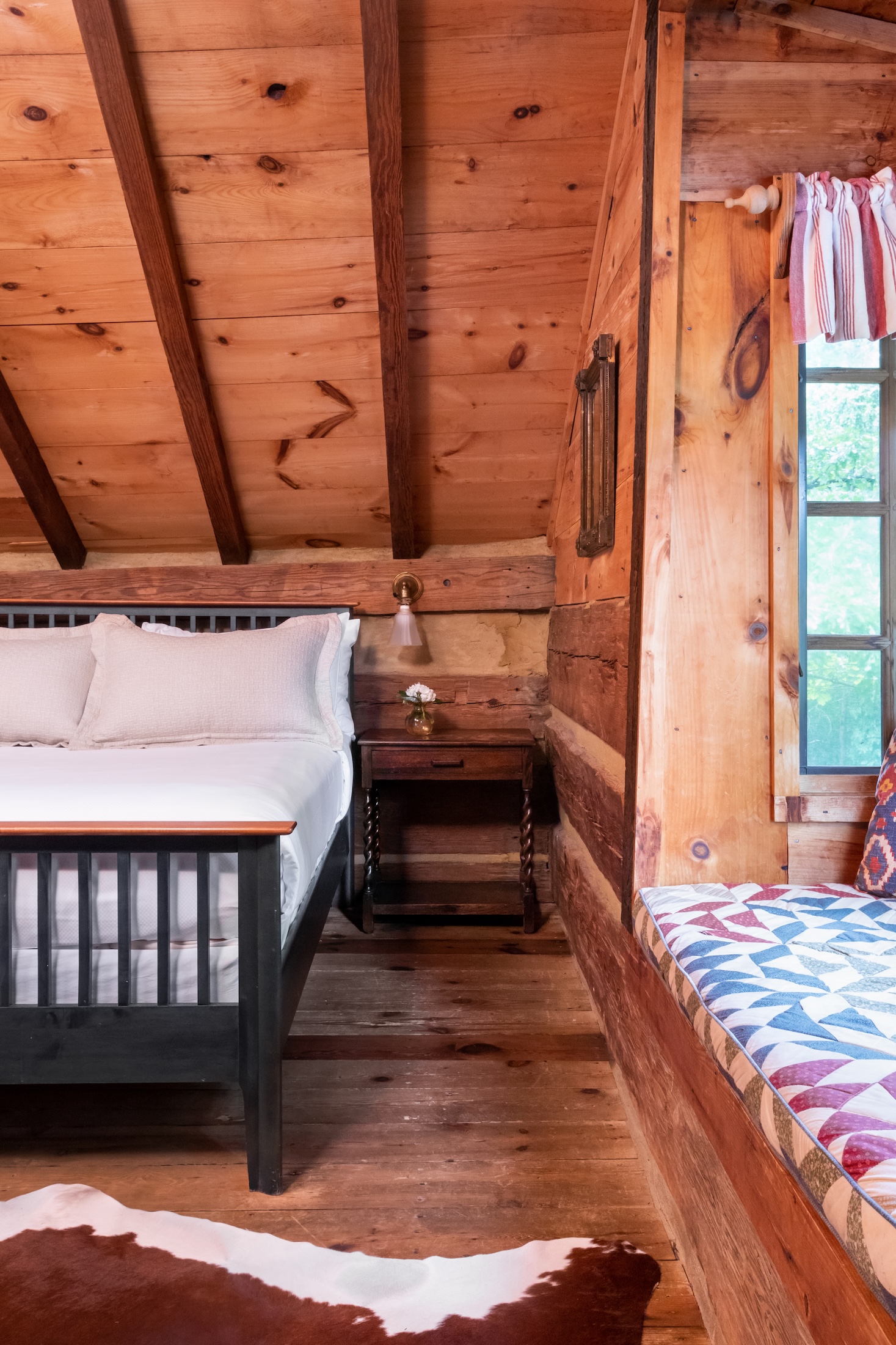 A queen bedroom in the Fugger Cabin at Barnsley Resort.