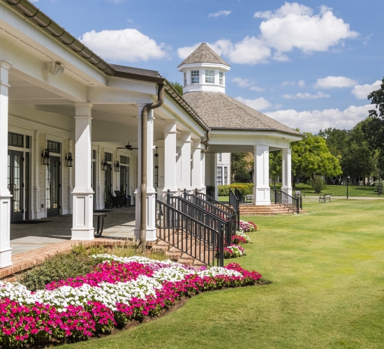 The exterior of Georgian Hall on a sunny day at Barnsley Resort.