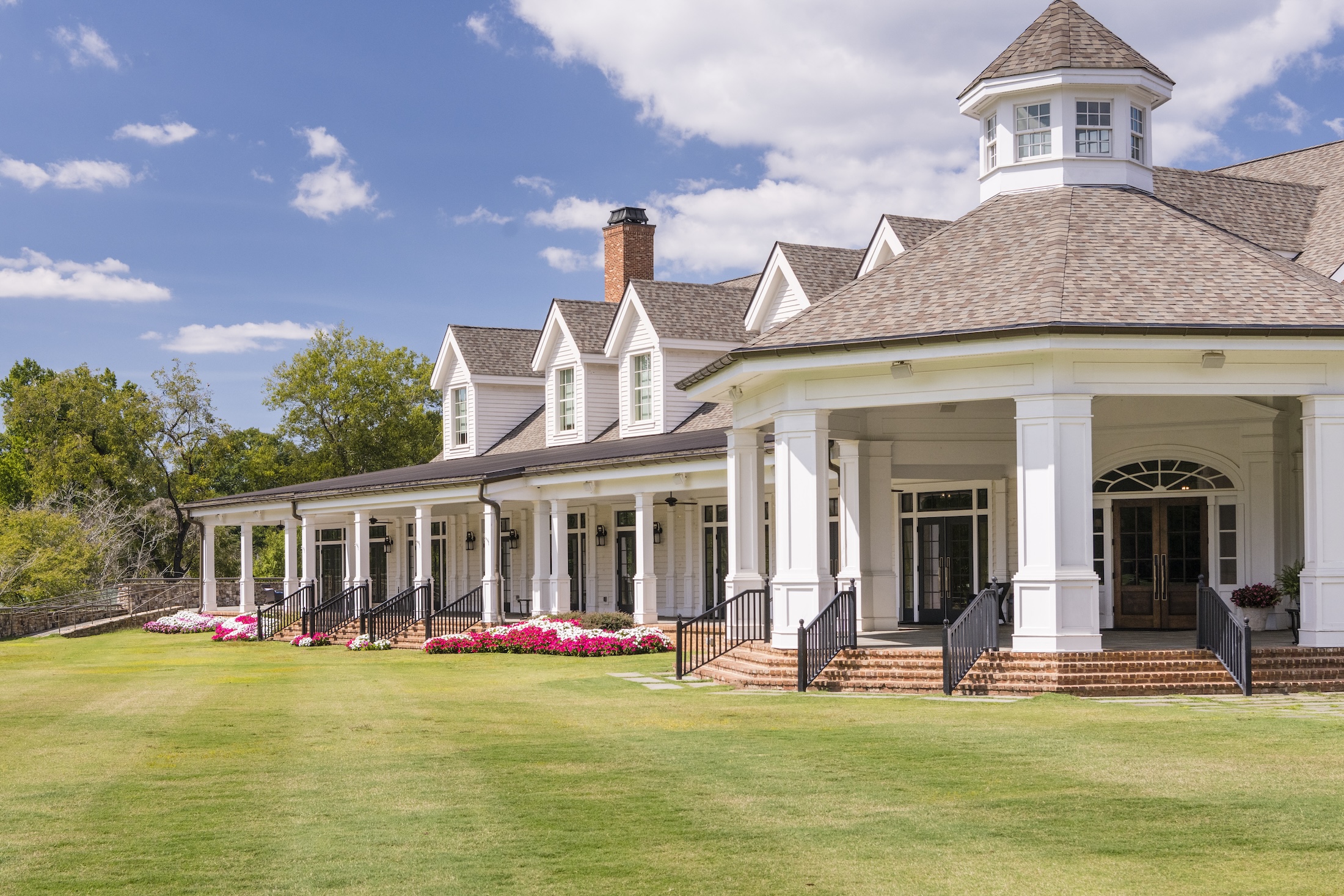 The exterior of Georgian Hall on a sunny day at Barnsley Resort.