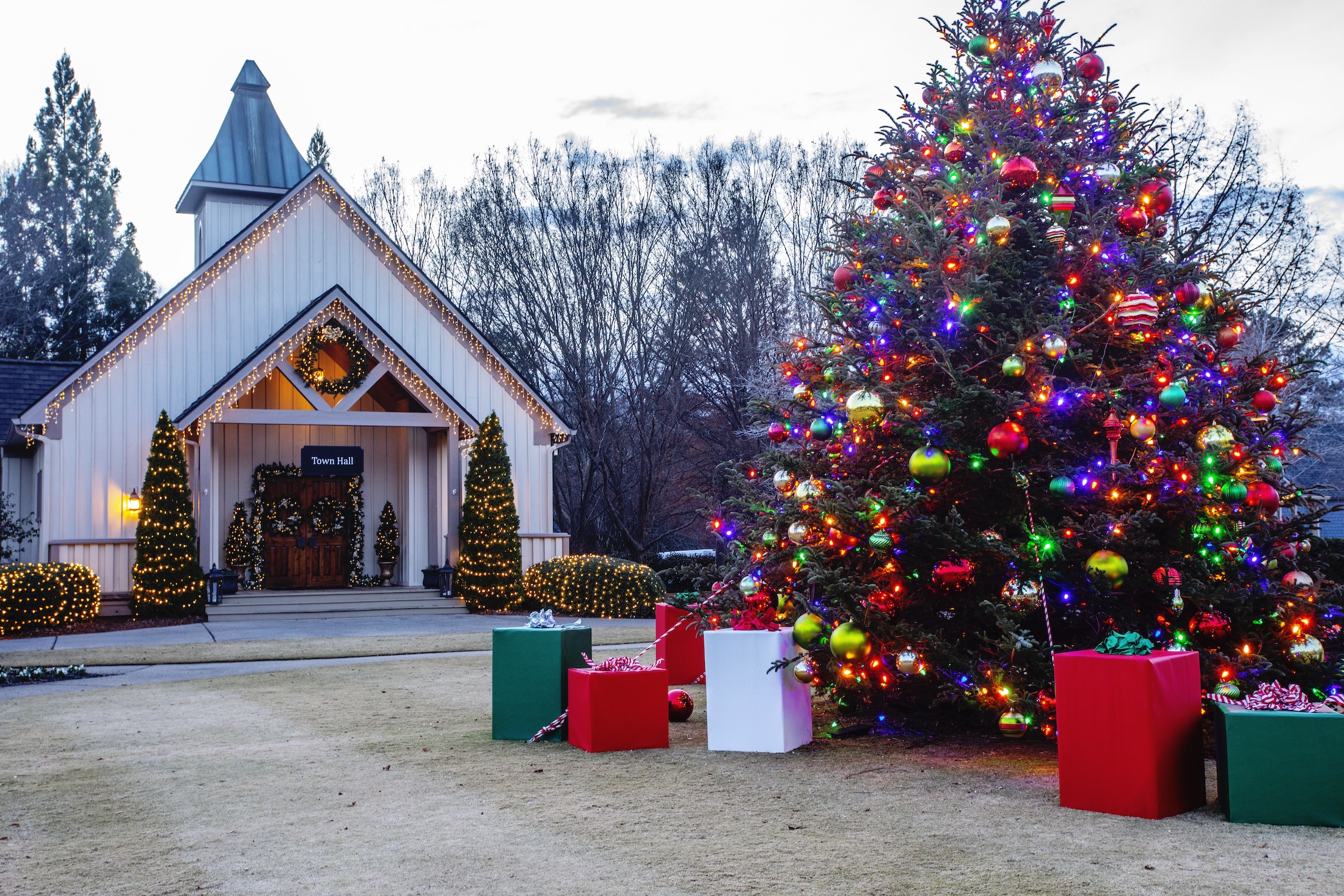 A decorated and lit Christmas tree outside of Town Hall at Barnsley Resort.