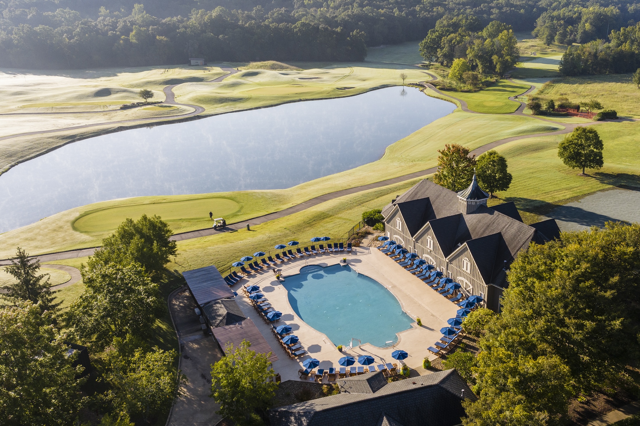 An aerial view of the resort pool looking out on the golf course at Barnsley Resort