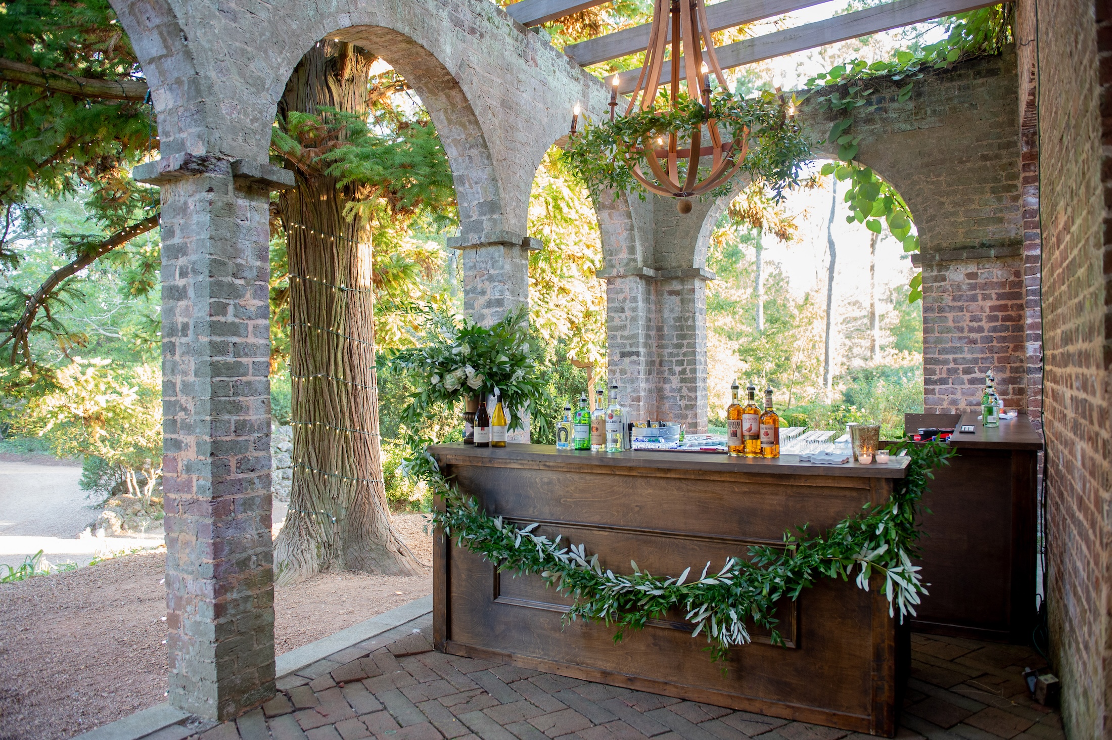 A rustic looking outdoor bar set up for a wedding at Barnsley Resort.