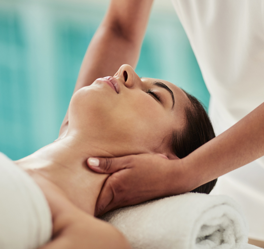 A woman receives a neck massage.