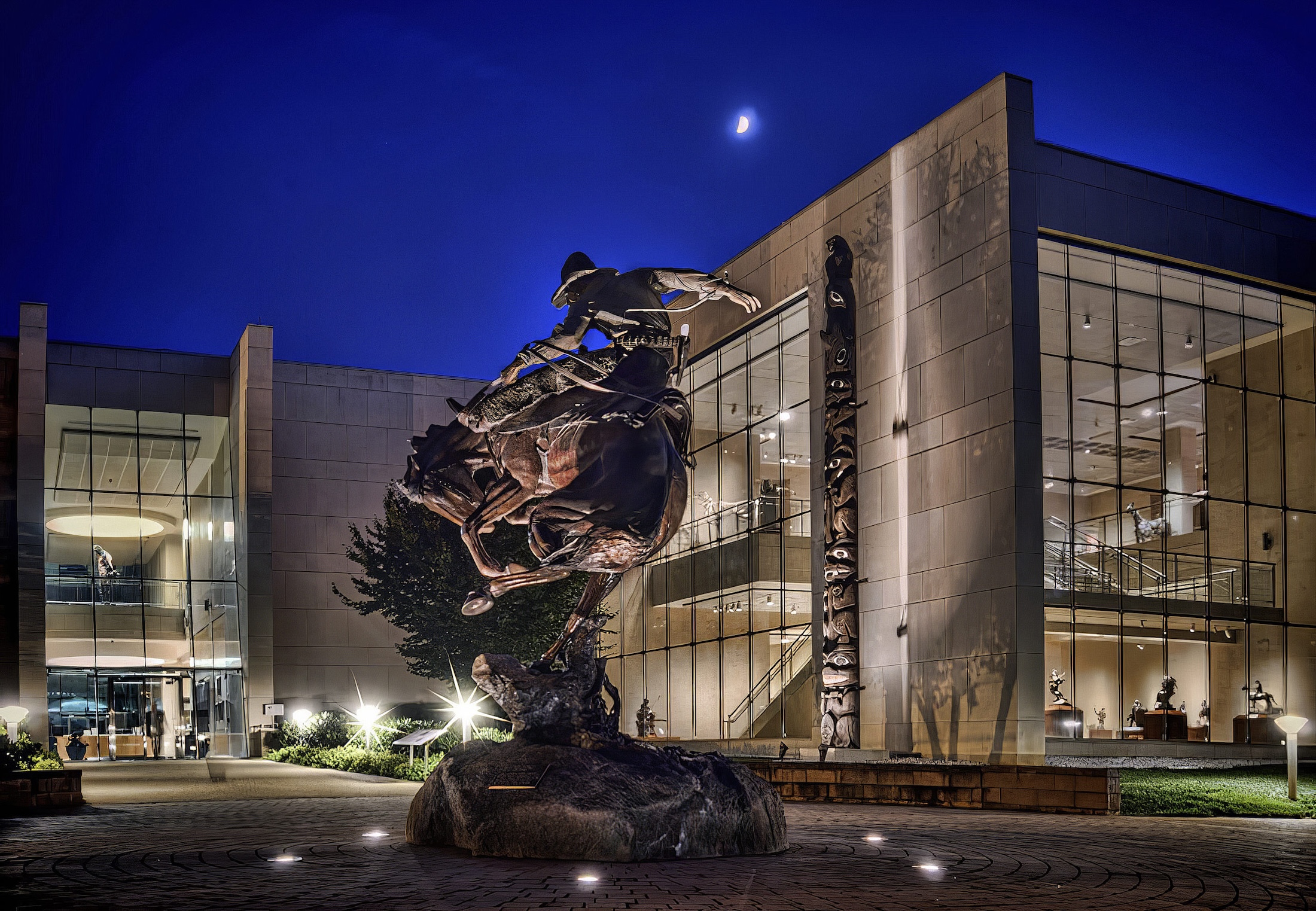 The exterior of the Booth Museum at night.