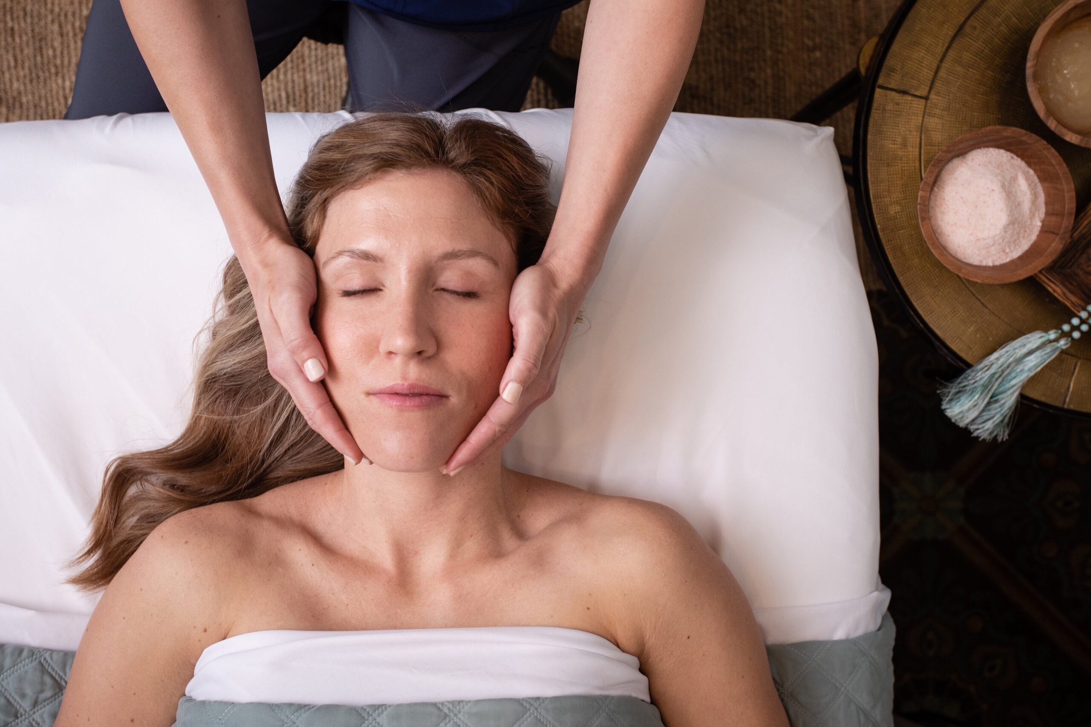 A woman receiving a facial.