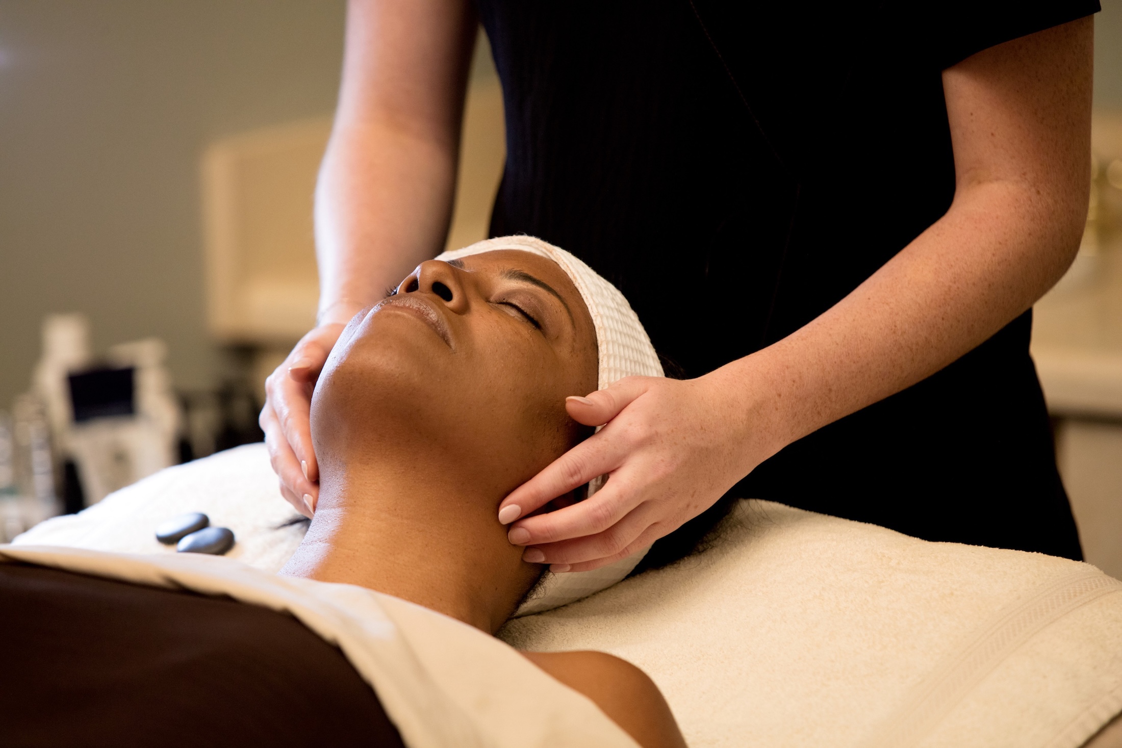 A woman receiving a facial.