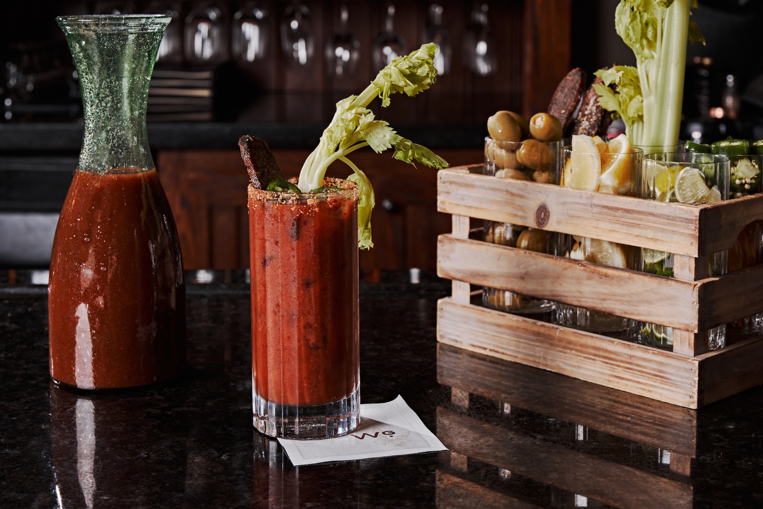 A Bloody Mary cocktail with assorted garnishes.