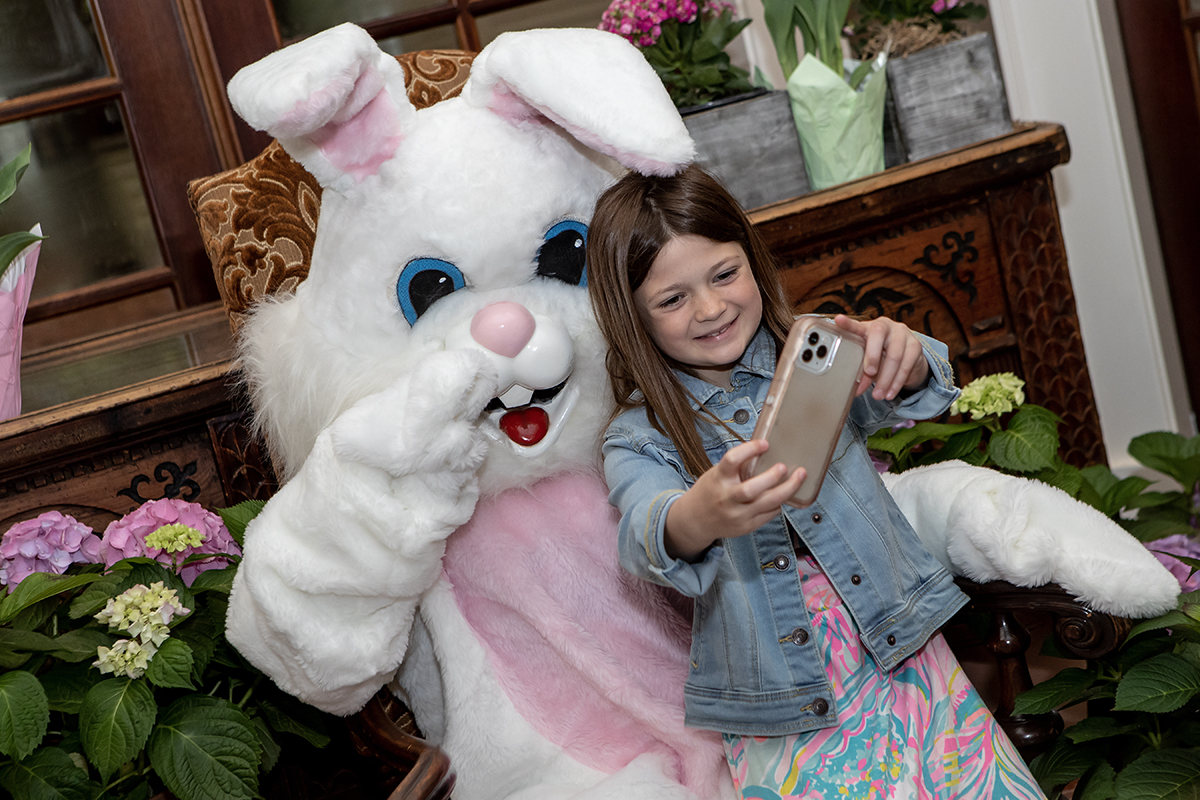 Girl taking selfie with the Easter Bunny